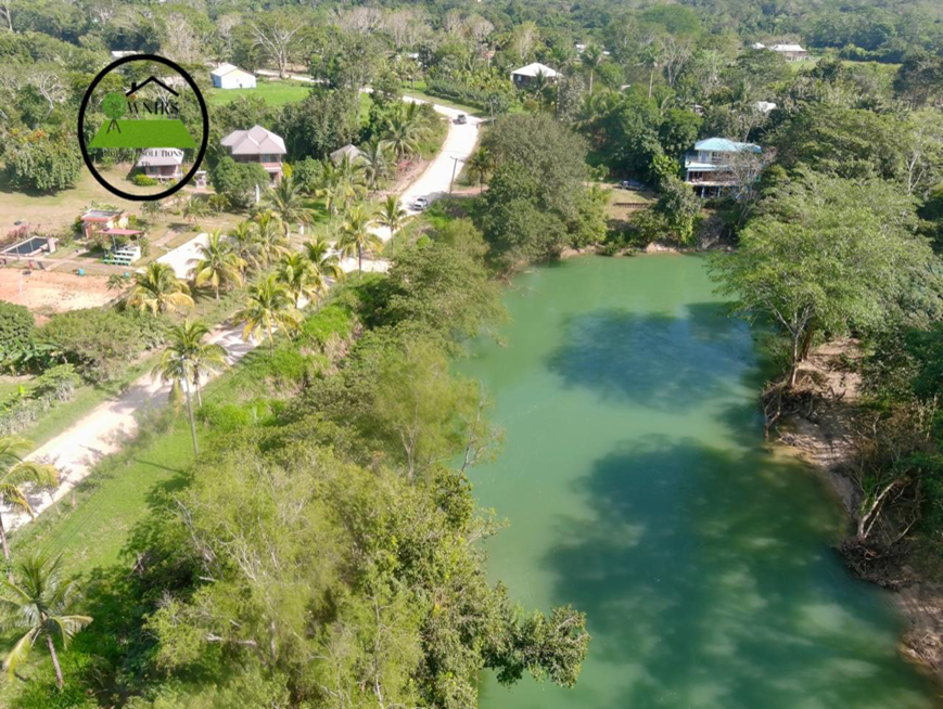 892.010 square meters  of land being Entry no. 12744 along the Mopan River and the Bullet Tree Falls/Santa Familia Road, Paslow Falls Area Cayo District